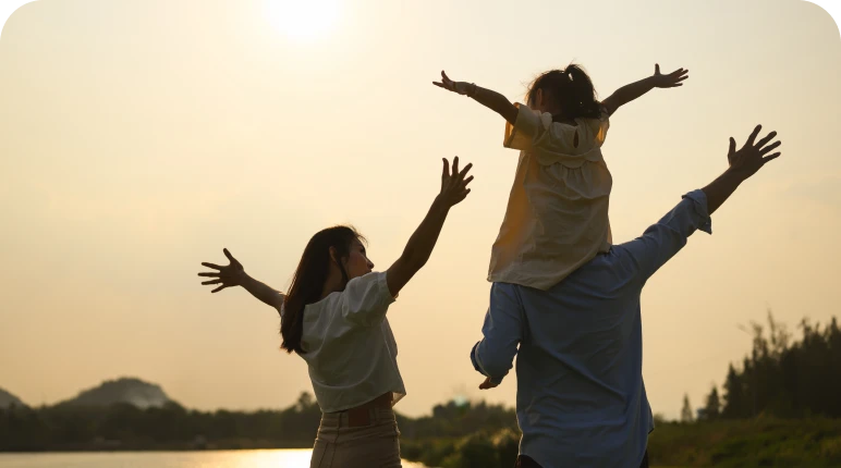 Parents and child with open arms