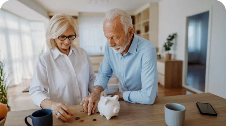 Older adults budgeting at home table